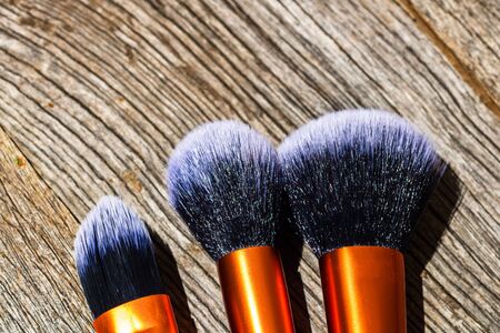 Make-up concept. Make-up brushes.  Concelear brush, foundation brush, blush brush and powder brush.の写真素材