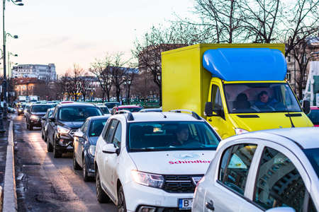 Car traffic at rush hour in downtown area of the city. Car pollution, traffic jam in the morning and evening in the capital city of Bucharest, Romania, 2020のeditorial素材