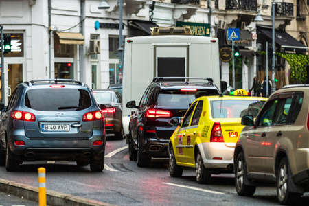 Car traffic at rush hour in downtown area of the city. Car pollution, traffic jam in the morning and evening in the capital city of Bucharest, Romania, 2020のeditorial素材