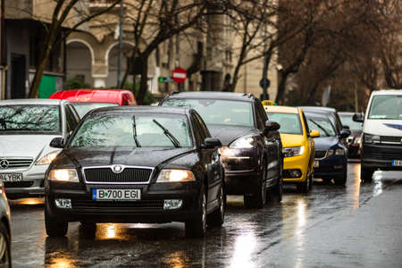 Car traffic at rush hour in downtown area of the city. Car pollution, traffic jam in the morning and evening in the capital city of Bucharest, Romania, 2020のeditorial素材