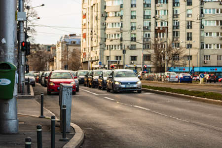 Car traffic at rush hour in downtown area of the city. Car pollution, traffic jam in the morning and evening in the capital city of Bucharest, Romania, 2020のeditorial素材