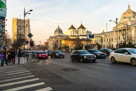 Car traffic at rush hour in downtown area of the city. Car pollution, traffic jam in the morning and evening in the capital city of Bucharest, Romania, 2020のeditorial素材
