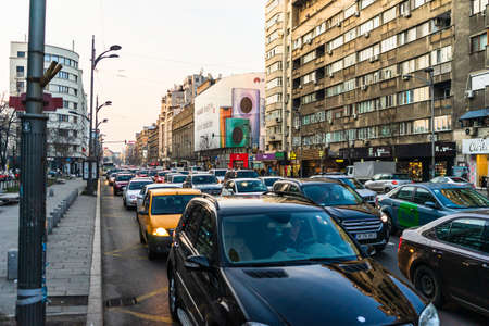 Car traffic at rush hour in downtown area of the city. Car pollution, traffic jam in the morning and evening in the capital city of Bucharest, Romania, 2020のeditorial素材