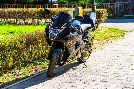 Suzuki motorcycle parked on the alley of a park in Targoviste, Romania, 2020