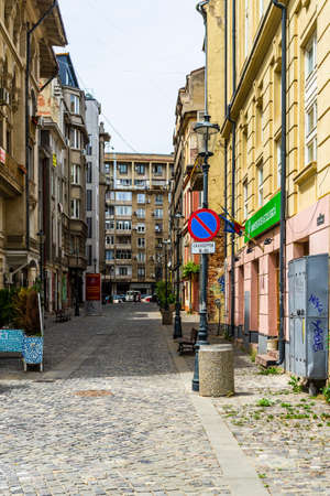 Empty tables at local restaurants in Old Town Bucharest due to coronavirus worldwide outbreak crisis. Deserted downtown, bar district in Bucharest, Romania, 2020のeditorial素材