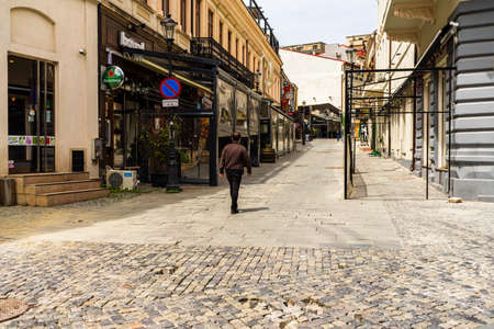 Empty tables at local restaurants in Old Town Bucharest due to coronavirus worldwide outbreak crisis. Deserted downtown, bar district in Bucharest, Romania, 2020のeditorial素材