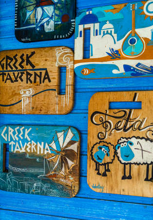 Hand made cutting boards on a wall outside of a Greek Tavern in Old Town of Bucharest, Romania, 2020のeditorial素材