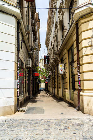 Empty tables at local restaurants in Old Town Bucharest due to coronavirus worldwide outbreak crisis. Deserted downtown, bar district in Bucharest, Romania, 2020のeditorial素材