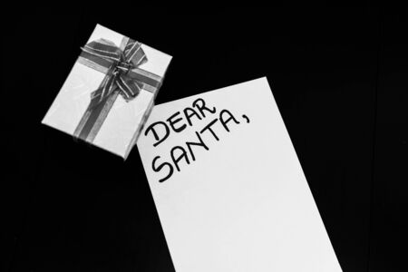 Writing Dear Santa for Christmas. Christmas letter. Text Dear Santa on paper.の写真素材