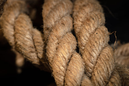 Abstract composition, texture details of thick and strong rope isolated on blurred background,