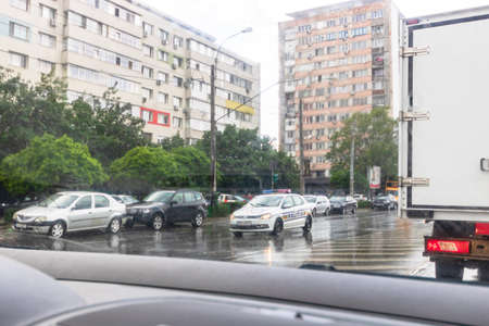 Traffic in cloudy rainy day with road view through car front window in Bucharest, Romania, 2020のeditorial素材
