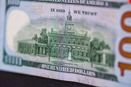 Selective focus on detail of 100 dollars banknote. Close up macro detail of money banknotes, dollars isolated. World money concept, inflation and economy conceptの写真素材