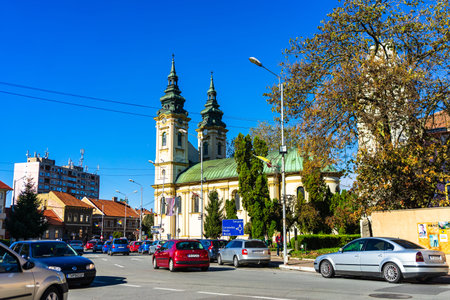 Old man riding a bike in downtown of Lugoj, Romania, 2020