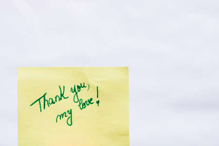 Thank you my love handwriting text close up isolated on yellow paper with copy space.の写真素材