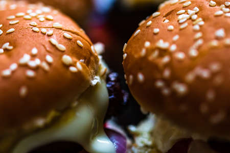 Closeup of fresh homemade tasty burgers on wooden tableの写真素材