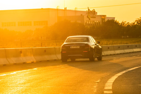 Car traffic at rush hour in downtown area. Traffic jam, cars on the road at sunset in Bucharest,...