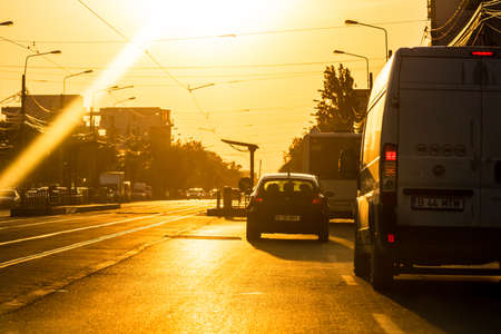 Car traffic at rush hour in downtown area. Traffic jam, cars on the road at sunset in Bucharest, Romania, 2020のeditorial素材