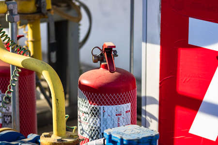 Close up of red fire extinguisher, emergency equipment for gas station in Bucharest, Romania, 2020のeditorial素材