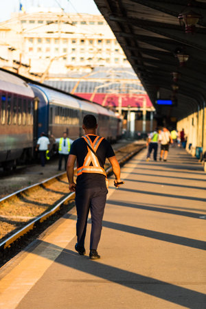 Train crew man doing checkings on the platform at the Bucharest North Railway Station in Bucharest,...
