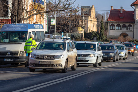 Cars in traffic car traffic at rush hour in downtown area of Targoviste, Romania, 2020のeditorial素材