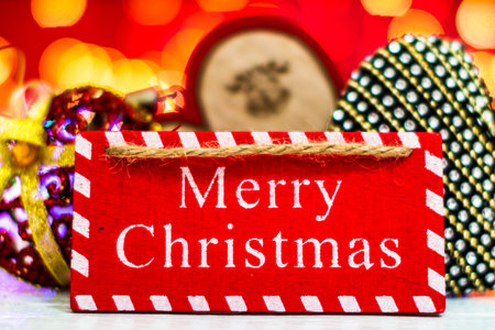 Merry Christmas text wooden sign, decorations and ornaments in a colorful Christmas composition.の写真素材