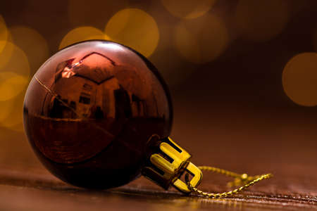 Colorful Christmas ball isolated on blurred and shiny background of lights. Christmas baubles isolated.の写真素材