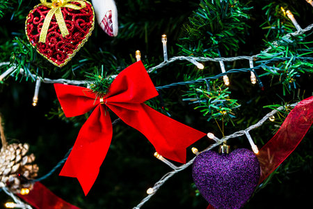 Christmas hanging decorations on fir tree. Decorated Christmas tree. Fir branch with Christmas...