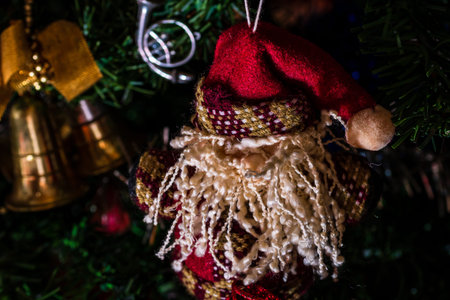 Christmas hanging decorations on fir tree. Decorated Christmas tree. Fir branch with Christmas baubles decorations.の写真素材