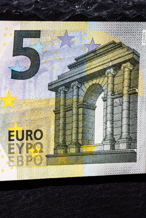 Selective focus on detail of euro banknotes. Close up macro detail of money banknotes, 5 euro...