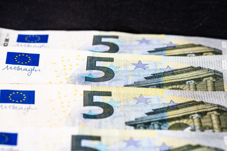 Selective focus on detail of euro banknotes. Close up macro detail of money banknotes, 5 euro...