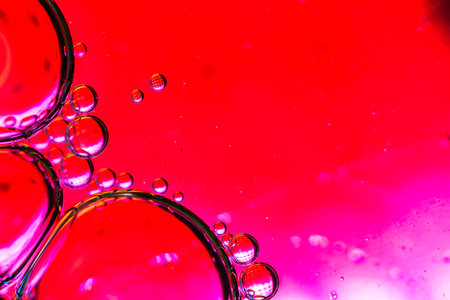 Abstract colorful backdrop with oil drops and waves on water surface. Abstract background concept