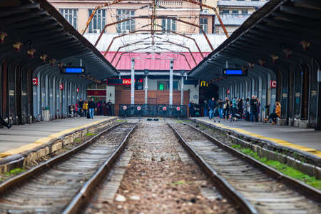 Changes and complications caused by coronavirus COVID-19 virus, world without crowds, empty train platform. No commuters, no travelers at the North Railway Station in Bucharest, Romania, 2020のeditorial素材