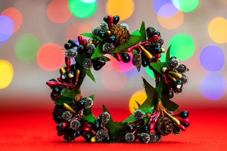 Colorful decorated Christmas wreaths isolated on background of blurred lights.