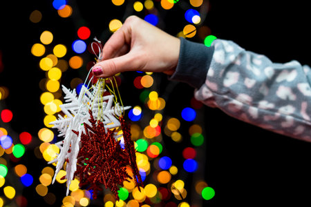 Woman's hands hold christmas decoration. Christmas and New Year holidays background, winter season...
