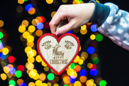 Woman's hands hold christmas decoration. Christmas and New Year holidays background, winter season...
