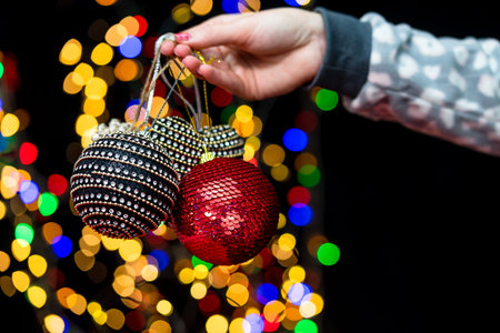 Woman's hands hold christmas decoration. Christmas and New Year holidays background, winter season...