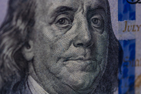 Selective focus on detail of 100 dollars banknote. Close up macro detail of money banknotes, dollars...
