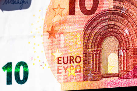 Selective focus on detail of euro banknotes. Close up macro detail of money banknotes, 10 euro isolated. World money concept, inflation and economy conceptの写真素材