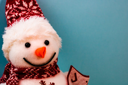 Snowman figurine isolated close up on details. Christmas composition with seasonal decorations and ornaments, christmassy mood.の写真素材