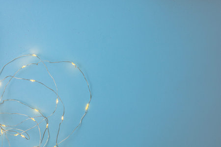 Decorated background with Christmas lights installation. Top view with copy space Christmas composition.の写真素材