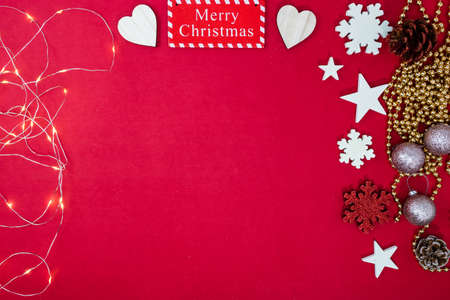Decorated red Christmas background with christmassy ornaments and decorations. Top view with copy space Christmas composition.の写真素材