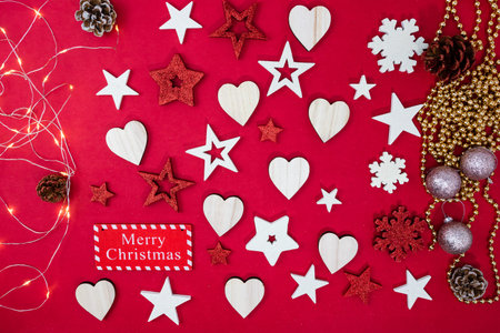 Decorated red Christmas background with christmassy ornaments and decorations. Top view with copy space Christmas composition.の写真素材