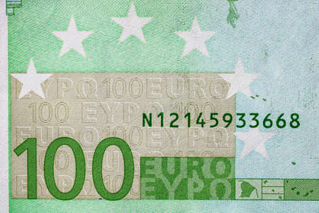 Selective focus on detail of euro banknotes. Close up macro detail of money banknotes, 100 euro isolated. World money concept, inflation and economy conceptの写真素材