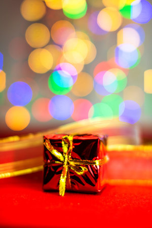 Blurred lights in Christmas composition with seasonal decorations and ornaments, colorful Christmas...