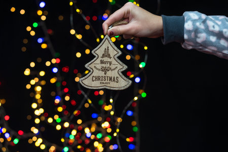 Woman's hands hold christmas decoration. Christmas and New Year holidays background, winter season...