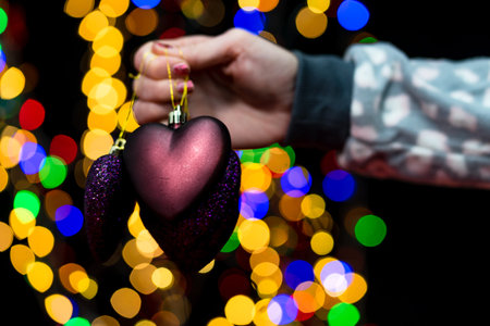 Woman's hands hold christmas decoration. Christmas and New Year holidays background, winter season...
