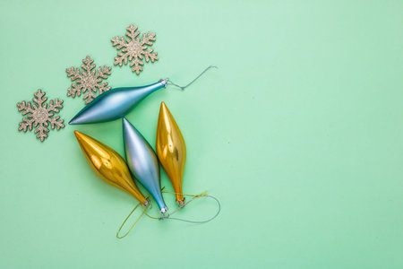 December season composition, top view with copy space on green background. Christmas composition...