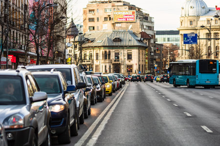 Car traffic at rush hour in downtown area of the city. Car pollution, traffic jam in the morning and...