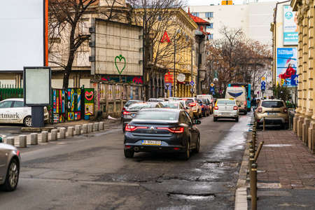 Car traffic at rush hour in downtown area of the city. Car pollution, traffic jam in the morning and evening in the capital city of Bucharest, Romania, 2020のeditorial素材