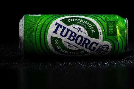 Condensation water droplets on Tuborg beer can isolated on black. Bucharest, Romania, 2020